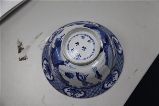 A Chinese blue and white flared bowl, Kangxi period, 21cm diam., broken and restuck